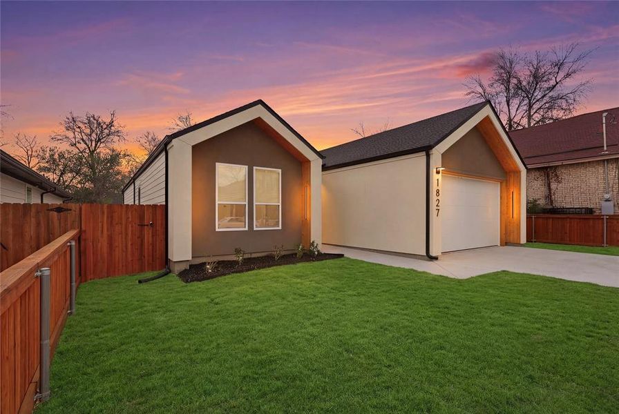 View of front of home featuring concrete driveway, stucco siding, and a shingled roof View of front of home featuring concrete driveway, stucco siding, and a shingled roof