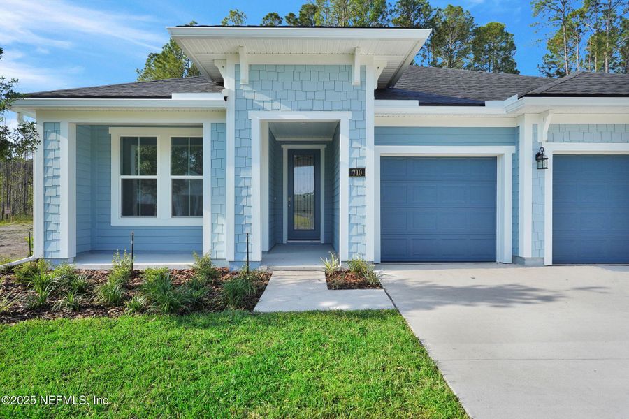 Front exterior of a new home in Trailmark - Phase 10, St. Augustine, FL, highlighting curb appeal (Image 2).