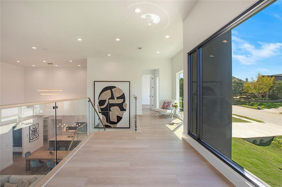 Corridor with light hardwood / wood-style floors