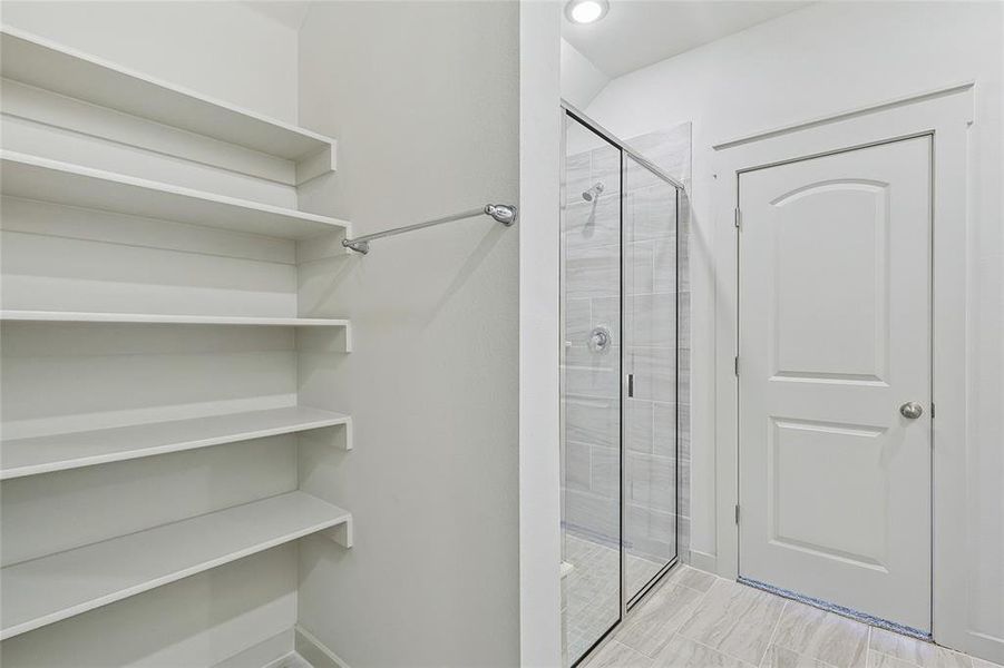 Bathroom with a shower with shower door