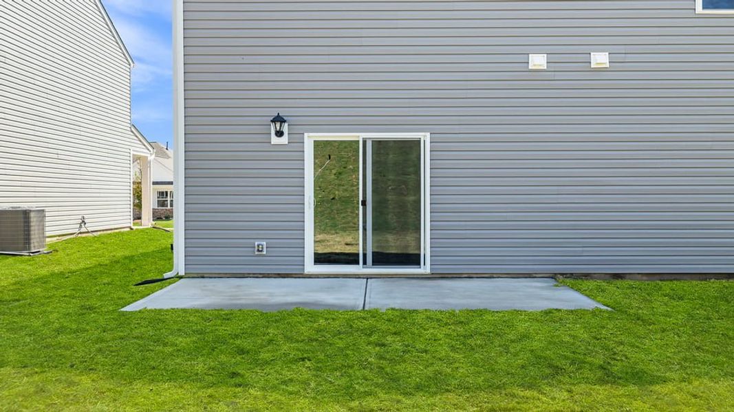 Exterior details and patio area of a home in Durbin Meadows Traditions, Fountain Inn (Image 3).