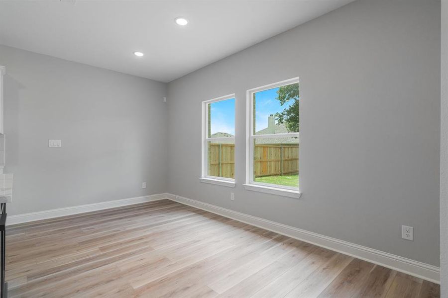 Spare room with light hardwood / wood-style flooring