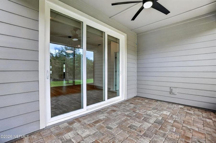 Exterior details and patio area of a home in Del Webb Wildlight, Wildlight (Image 24).