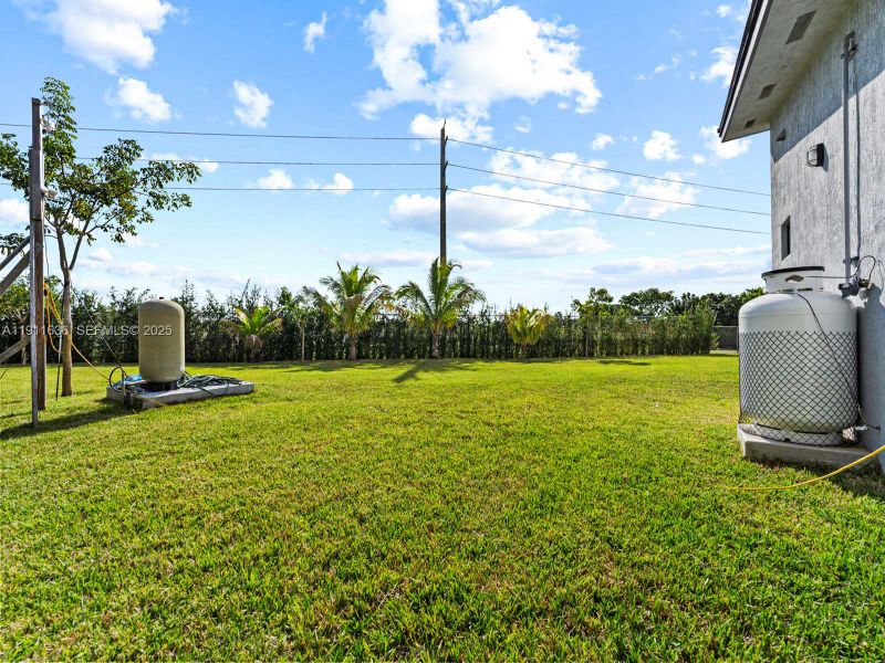 Exterior details and patio area of a home in , Goulds (Image 25).