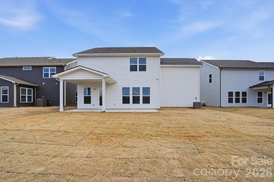 Exterior details and patio area of a home in Forest Creek, Waxhaw (Image 25).