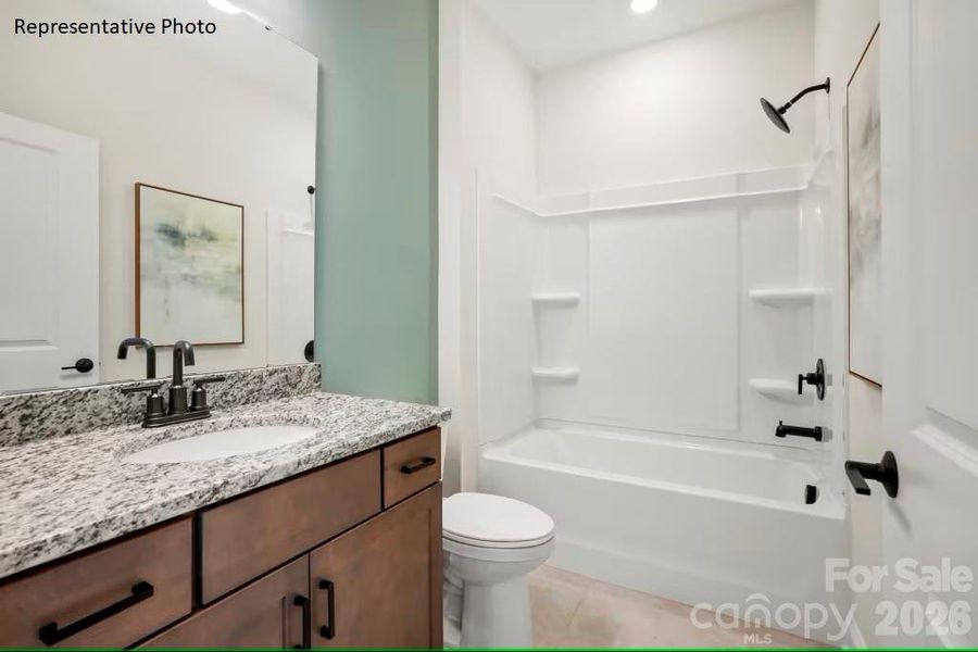 Secondary bathroom features tub/shower combo