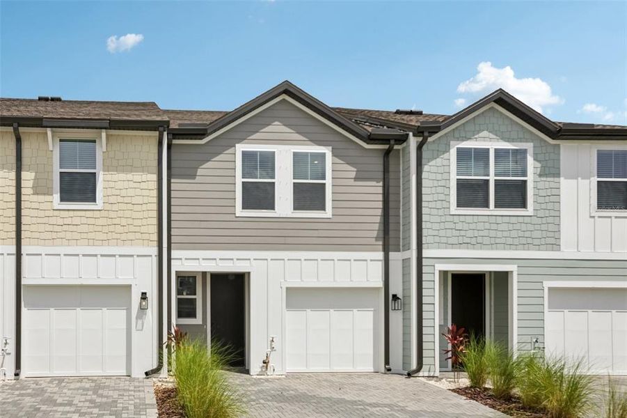 Front exterior of a new home in , Tampa, FL, highlighting curb appeal (Image 1).