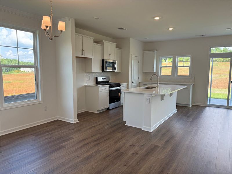 A well-appointed kitchen features a central island A well-appointed kitchen features a central island