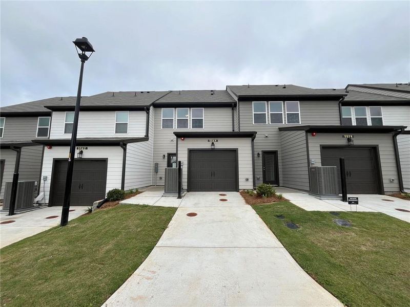 Front exterior of a new home in Laurelwood, Douglasville, GA, highlighting curb appeal (Image 17).