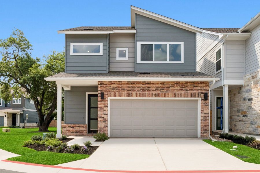 Front exterior of a new home in Village on Cooper Lane 26', Austin, TX, highlighting curb appeal (Image 1).