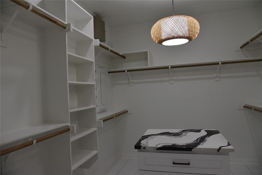 Spacious closet featuring light tile patterned floors