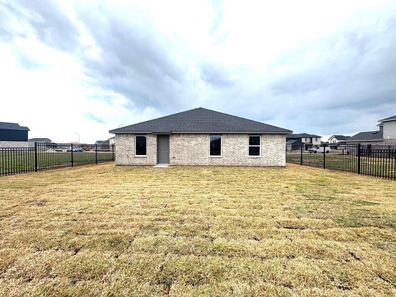 Exterior details and patio area of a home in Sunterra, Katy (Image 3).