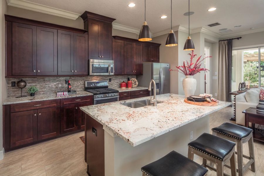 Representative furnished interior of a home built from the Daytona by Jones Homes USA in Twin Lakes, St. Cloud (Image 5).
