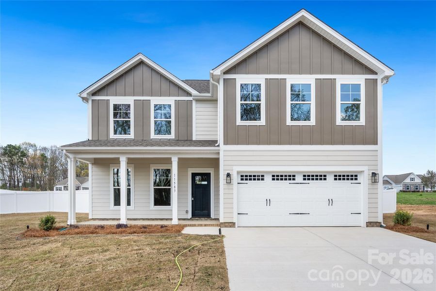 Front exterior of a new home in , Stanfield, NC, highlighting curb appeal (Image 17).