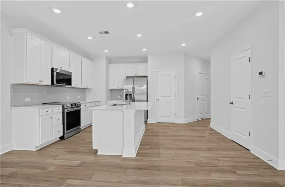 Furnished interior view inside a new home in Towns at Holly Springs, Holly Springs (Image 4).