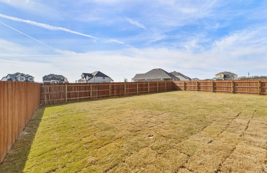 Exterior details and patio area of a home in Saddleback at Santa Rita Ranch, Liberty Hill (Image 25).