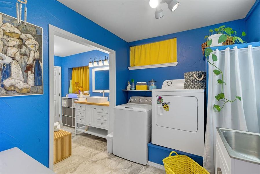 Laundry room featuring washing machine and dryer Laundry room featuring washing machine and dryer