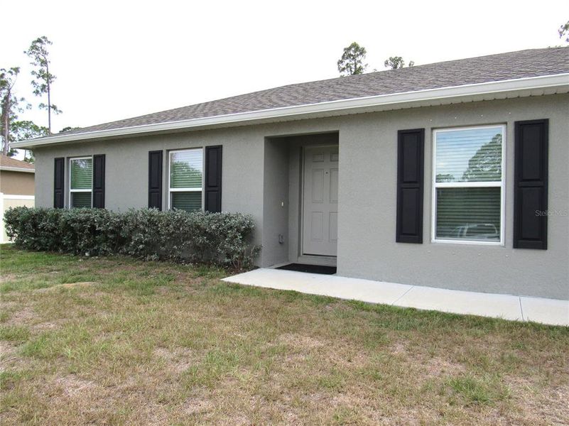 Exterior details and patio area of a home in , North Port (Image 16).