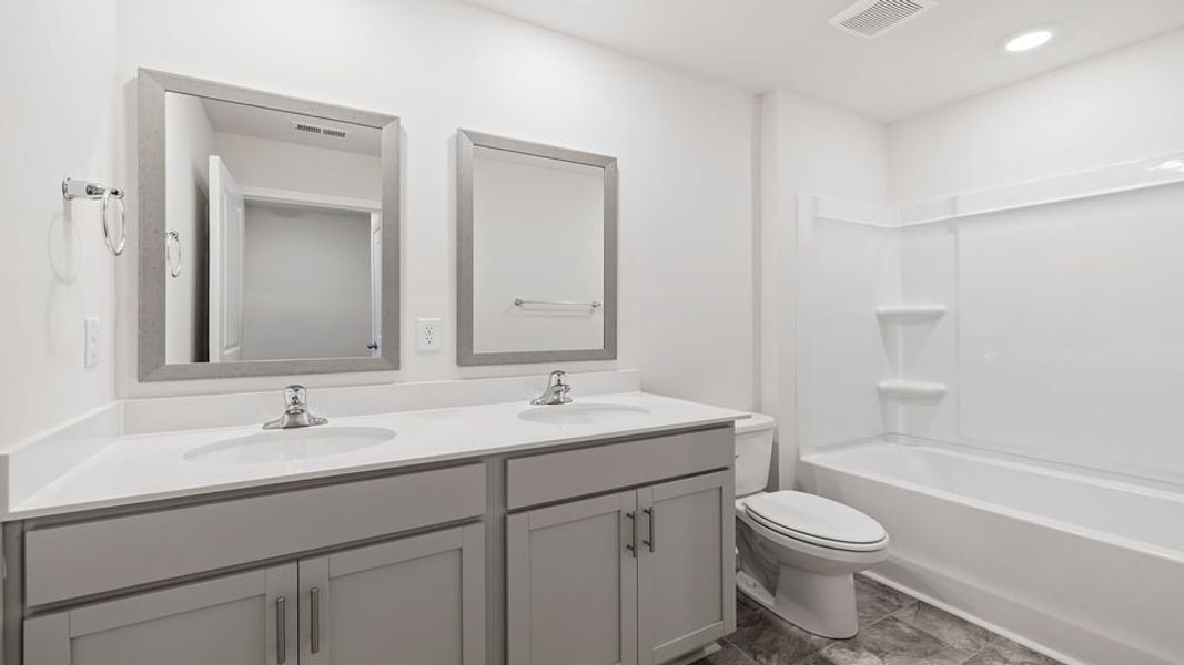 Furnished interior view inside a new home in Bentley Park, Greenwood (Image 8).
