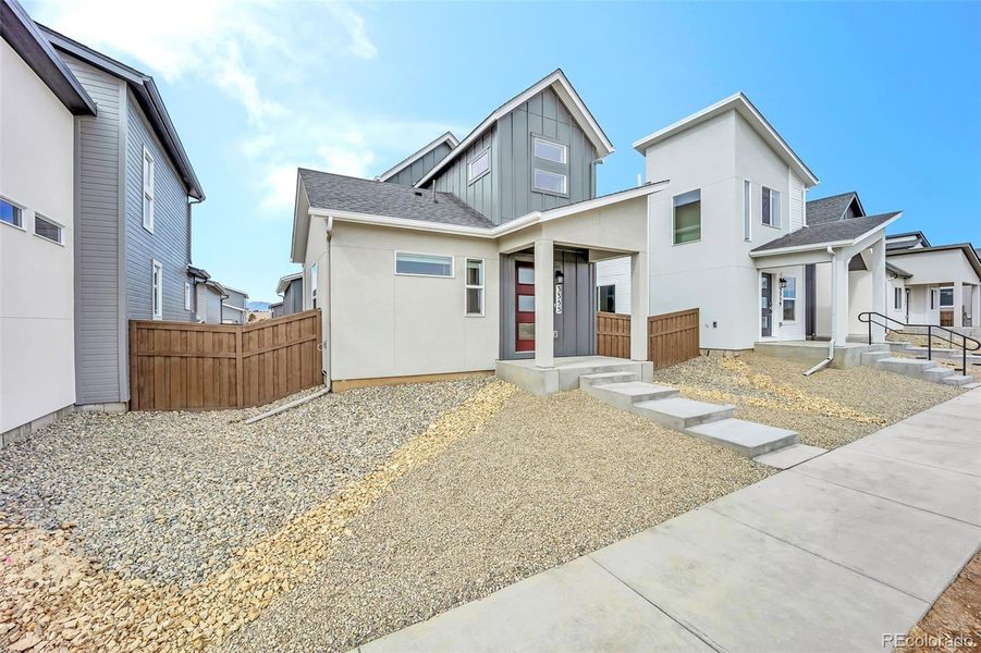 Front exterior of a new home in , Colorado Springs, CO, highlighting curb appeal (Image 24). Front exterior of a new home in , Colorado Springs, CO, highlighting curb appeal (Image 24).
