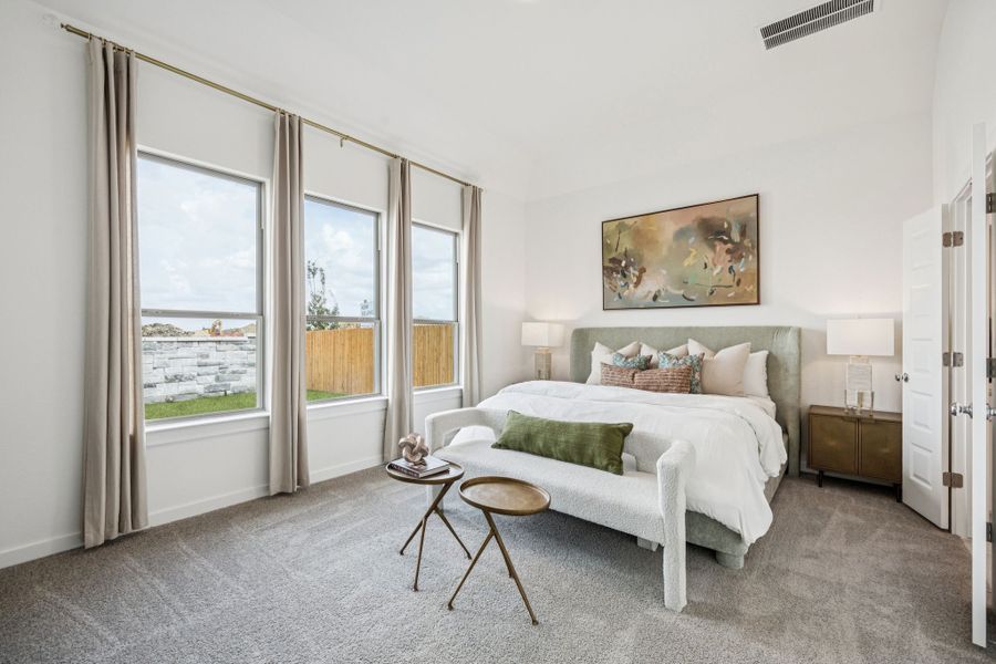 Primary Suite in the Trinity home plan by Trophy Signature Homes – REPRESENTATIVE PHOTO