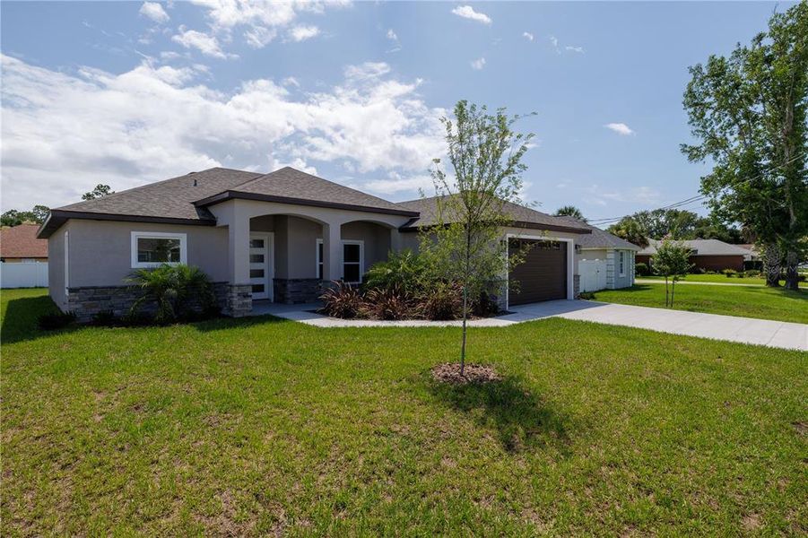 Front exterior of a new home in , Palm Coast, FL, highlighting curb appeal (Image 19).