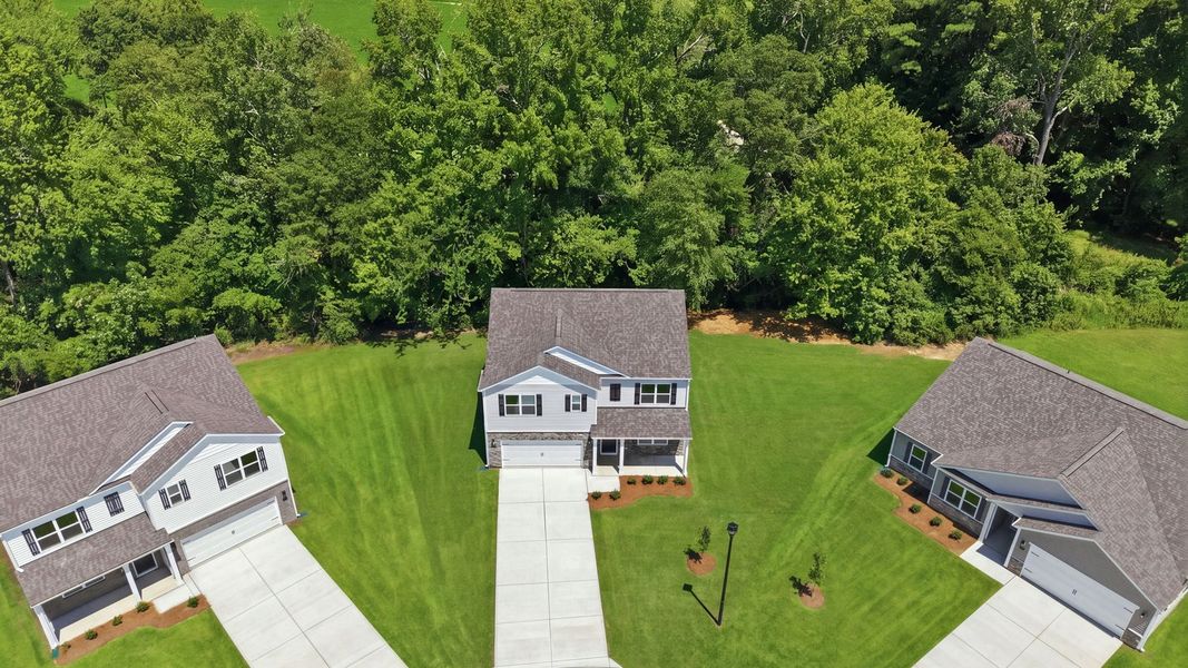 Front exterior of a new home in Villa Grande, Winterville, NC, highlighting curb appeal (Image 18).
