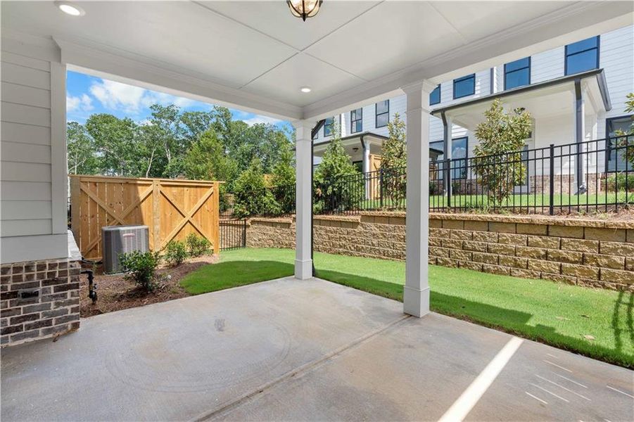 Exterior details and patio area of a home in Millcroft Townhomes, Buford (Image 4).