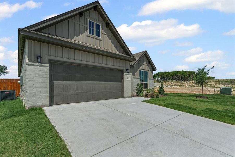 Front exterior of a new home in , Glen Rose, TX, highlighting curb appeal (Image 23). Front exterior of a new home in , Glen Rose, TX, highlighting curb appeal (Image 23).