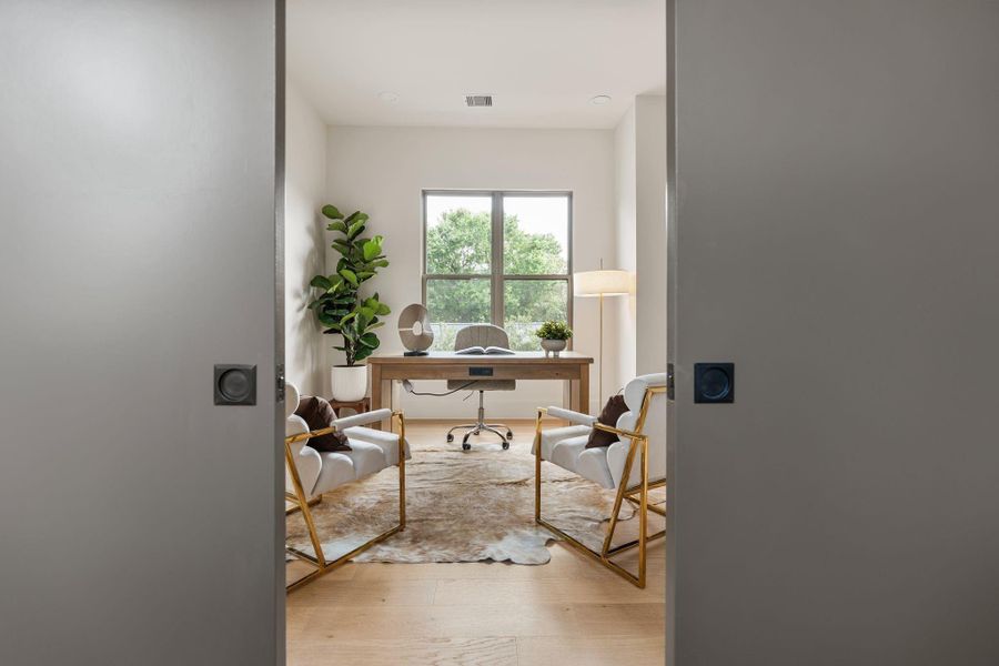 Concealed behind pocket doors, the study provides a quiet and private workspace within the home. Concealed behind pocket doors, the study provides a quiet and private workspace within the home.