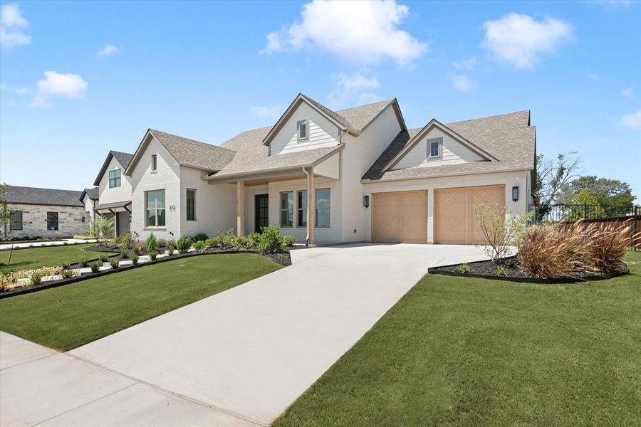 View of front of home featuring a front lawn