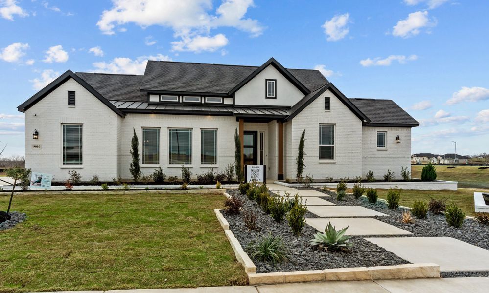Front exterior of a new home in Lariat, Liberty Hill, TX, highlighting curb appeal (Image 28).