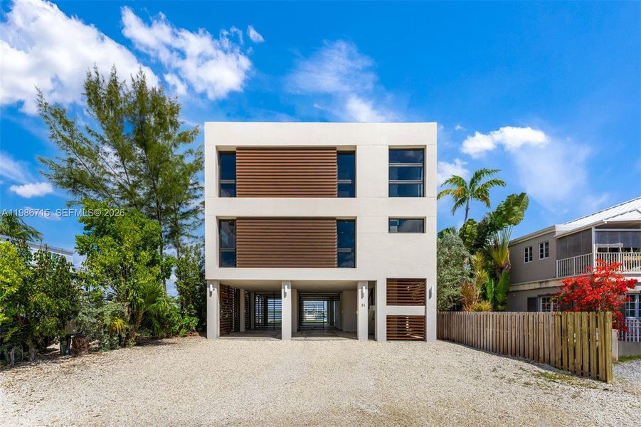 Front exterior of a new home in , Key Largo, FL, highlighting curb appeal (Image 1). Front exterior of a new home in , Key Largo, FL, highlighting curb appeal (Image 1).