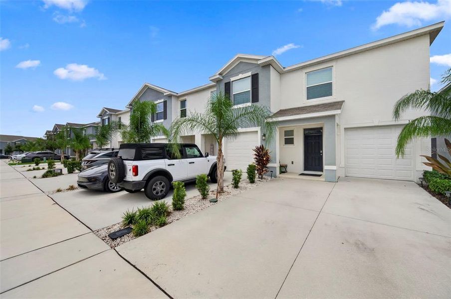 Front exterior of a new home in , Apollo Beach, FL, highlighting curb appeal (Image 26).