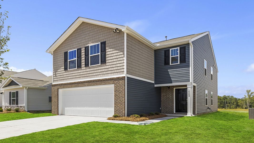 Front exterior of a new home in Baxter Village, Boiling Springs, SC, highlighting curb appeal (Image 2). Front exterior of a new home in Baxter Village, Boiling Springs, SC, highlighting curb appeal (Image 2).