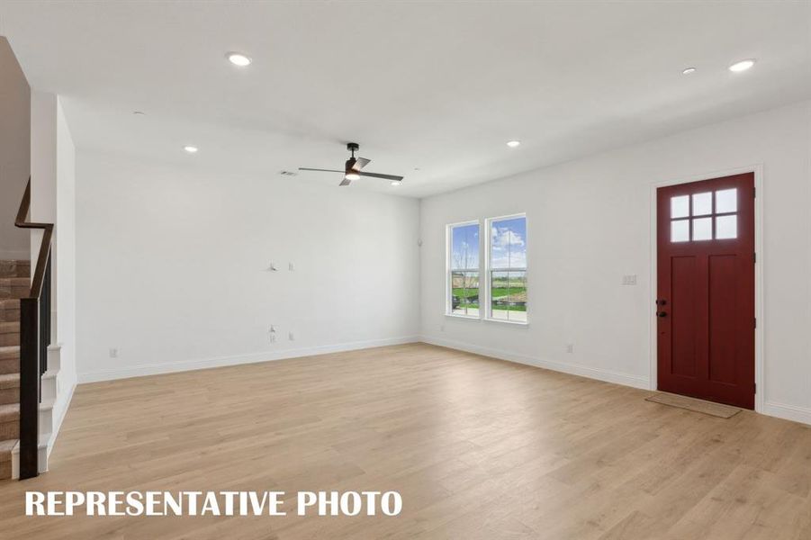 The light filled family room is large enough to seat the entire family!  REPRESENTATIVE PHOTO
