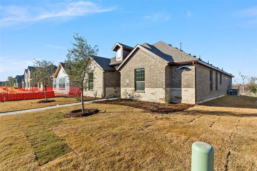 View of front of property with a front lawn