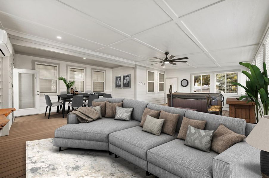 Living room with an AC wall unit, ceiling fan, and coffered ceiling Living room with an AC wall unit, ceiling fan, and coffered ceiling