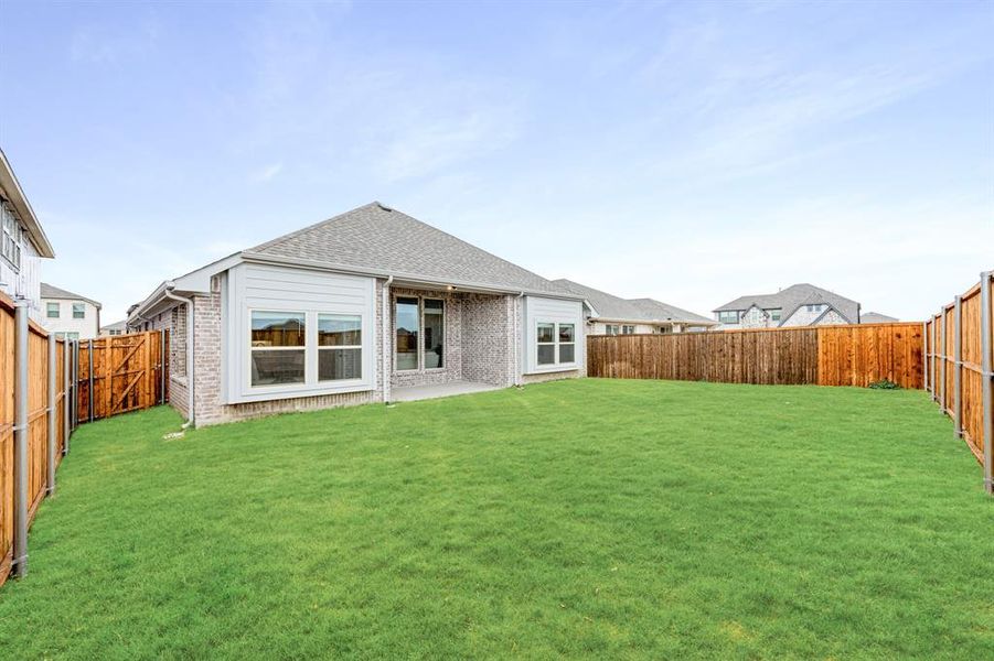 Exterior details and patio area of a home in ArrowBrooke, Aubrey (Image 3).