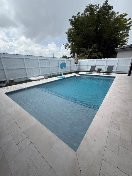 Exterior details and patio area of a home in Beacon at Galiano Pointe, Miami (Image 16). Exterior details and patio area of a home in Beacon at Galiano Pointe, Miami (Image 16).