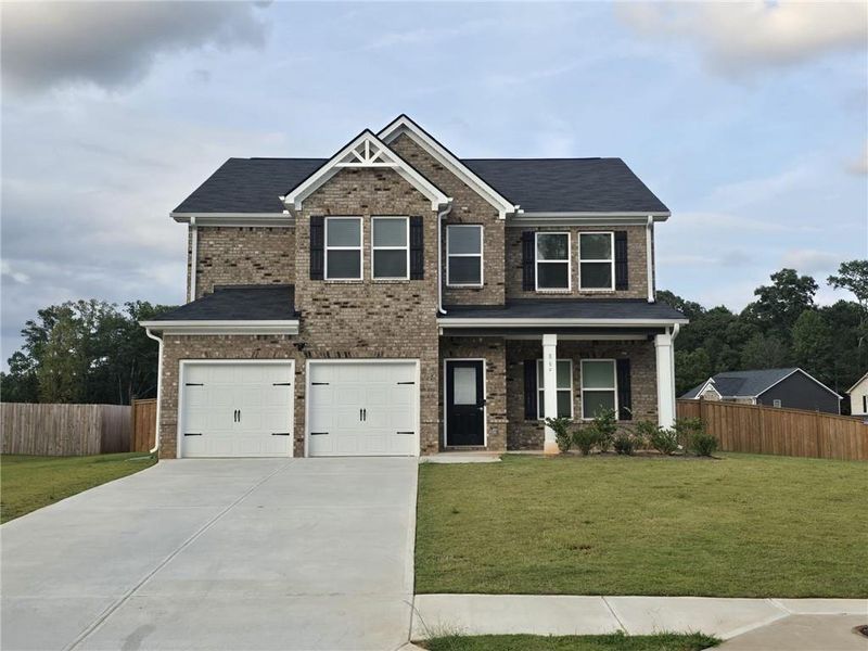 Front exterior of a new home in Fern Dale, Fairburn, GA, highlighting curb appeal (Image 38).