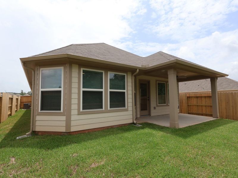 Exterior details and patio area of a home in Lone Star Landing, Montgomery (Image 3). Exterior details and patio area of a home in Lone Star Landing, Montgomery (Image 3).