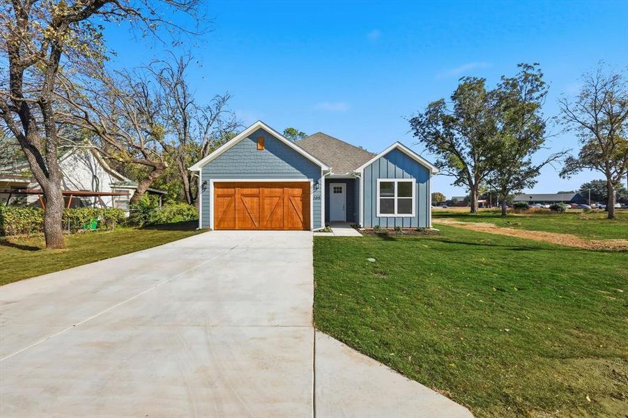 Front exterior of a new home in , Boyd, TX, highlighting curb appeal (Image 2).