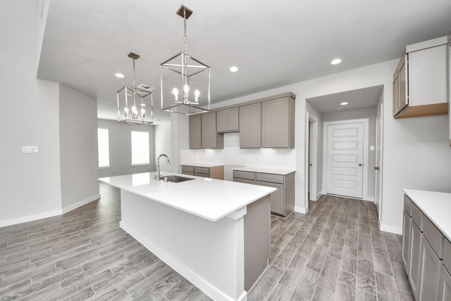 The extended counter area adds both practicality and style, making meal preparation a breeze. Every detail is thoughtfully designed to enhance the kitchen's functionality and aesthetic appeal.