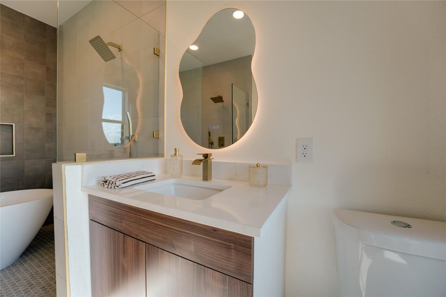 Sleek vanity with a contemporary mirror