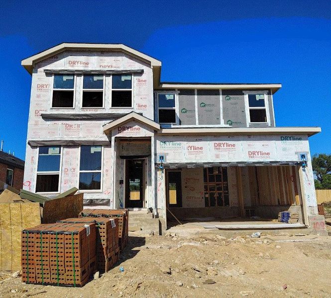 Front exterior of a new home in Woodside, Georgetown, TX, highlighting curb appeal (Image 16).