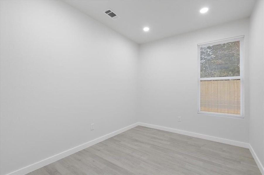 Unfurnished room featuring light hardwood / wood-style floors