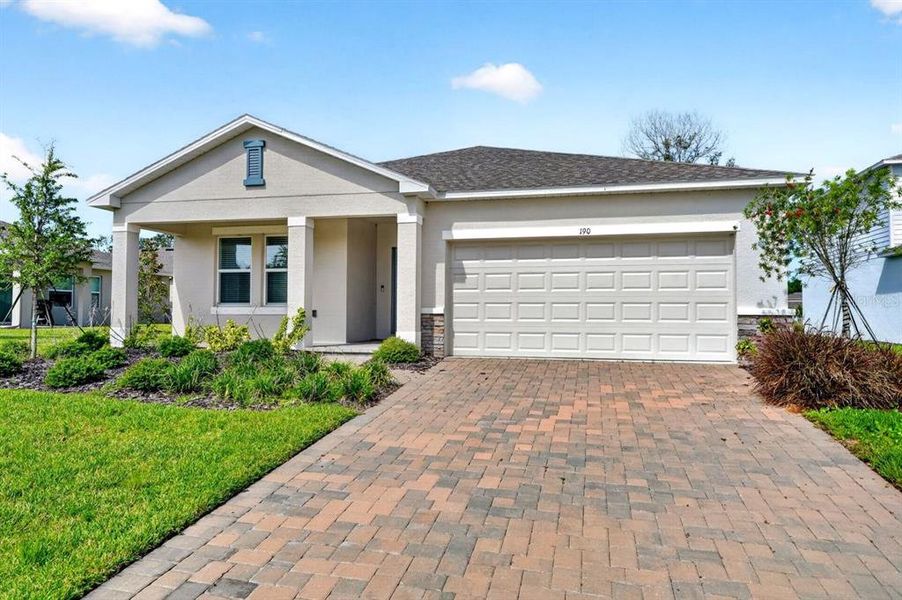 Front exterior of a new home in Riverfront, Edgewater, FL, highlighting curb appeal (Image 26). Front exterior of a new home in Riverfront, Edgewater, FL, highlighting curb appeal (Image 26).