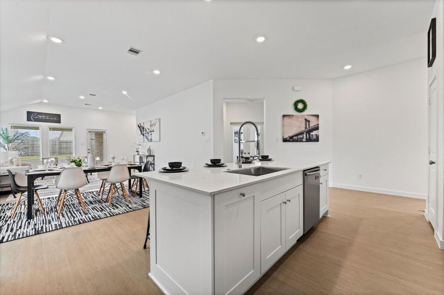 Open concept kitchen and dining area for family gatherings Open concept kitchen and dining area for family gatherings