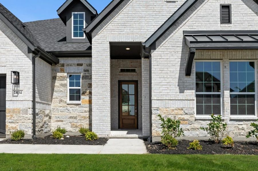 Exterior details and patio area of a home in Cambridge Crossing, Celina (Image 29). Exterior details and patio area of a home in Cambridge Crossing, Celina (Image 29).